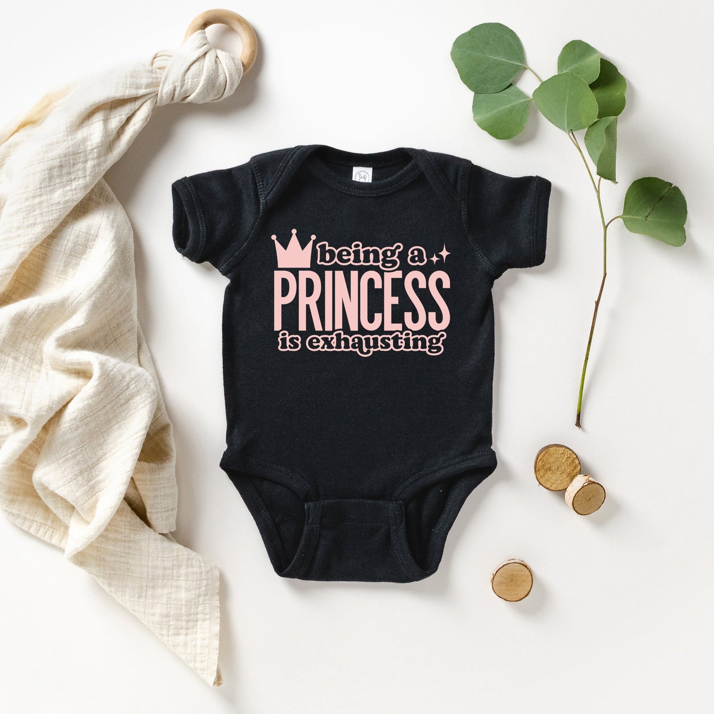 Being A Princess Is Exhausting | Baby Graphic Short Sleeve Onesie by The Juniper Shop