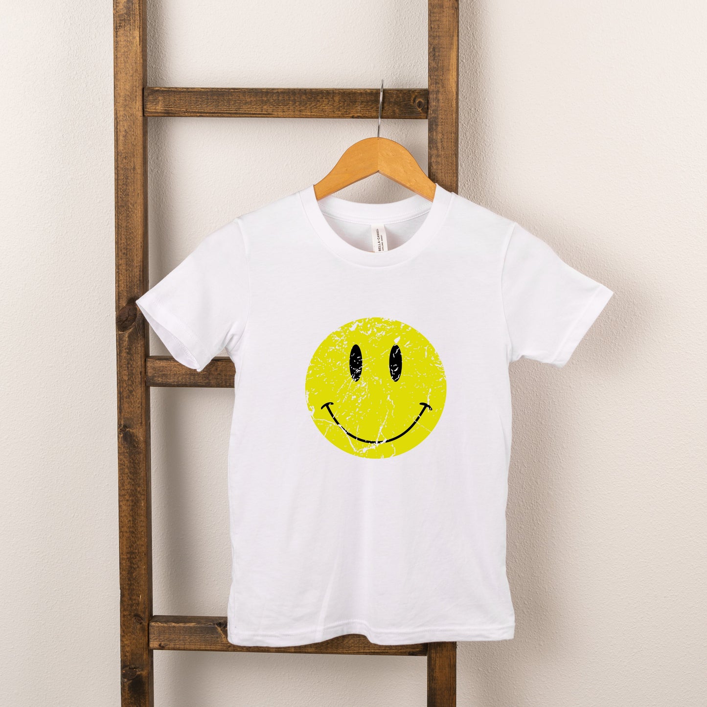 Distressed Smiley Face | Toddler Graphic Short Sleeve Tee by The Juniper Shop