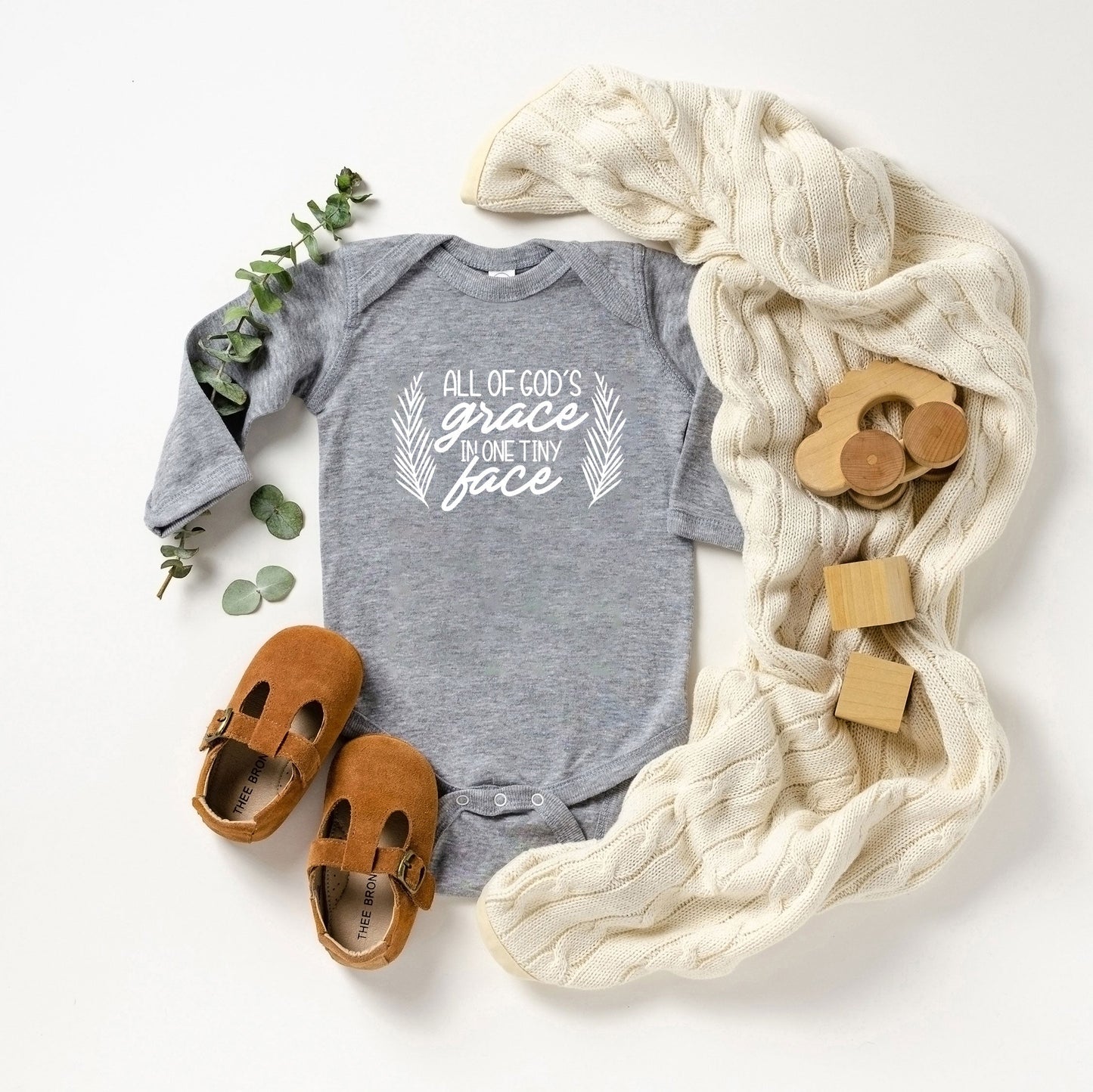 All Of God's Grace In One Tiny Face | Baby Long Sleeve Onesie by The Juniper Shop