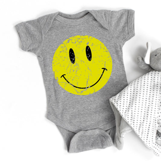 Distressed Smiley Face | Baby Graphic Short Sleeve Onesie by The Juniper Shop