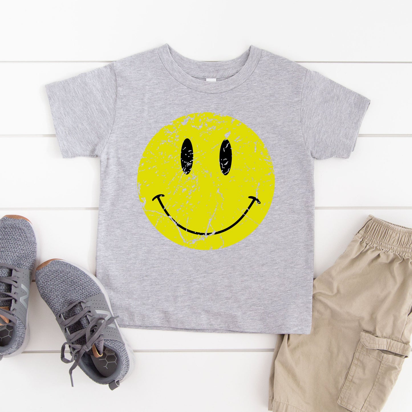 Distressed Smiley Face | Toddler Graphic Short Sleeve Tee by The Juniper Shop