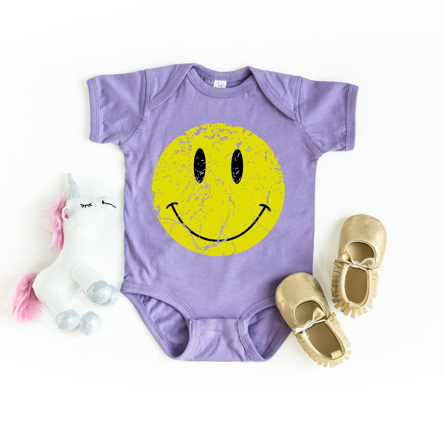 Distressed Smiley Face | Baby Graphic Short Sleeve Onesie by The Juniper Shop