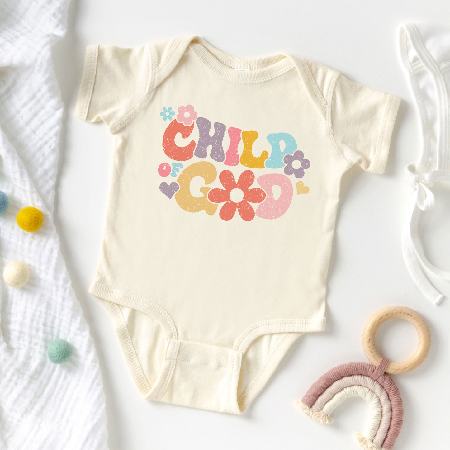 Child Of God Flowers | Baby Graphic Short Sleeve Onesie by The Juniper Shop