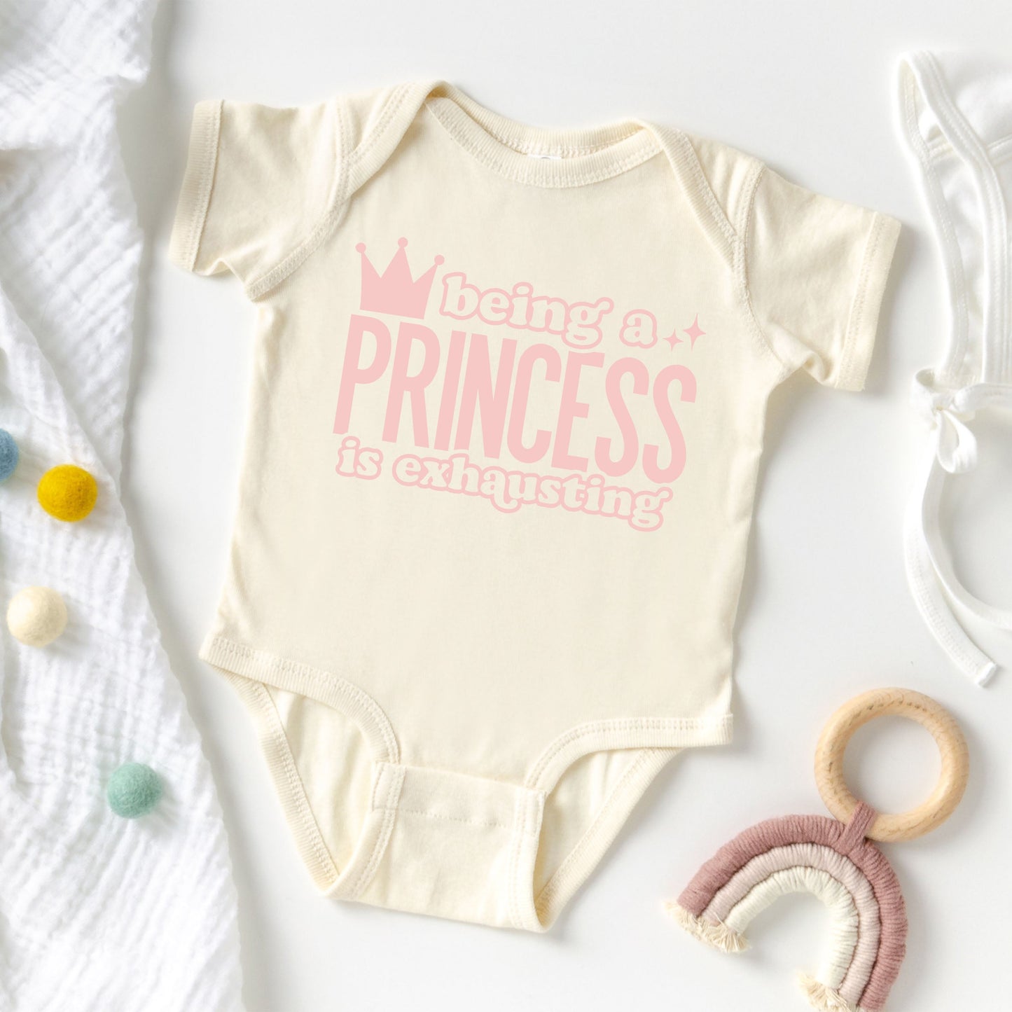 Being A Princess Is Exhausting | Baby Graphic Short Sleeve Onesie by The Juniper Shop