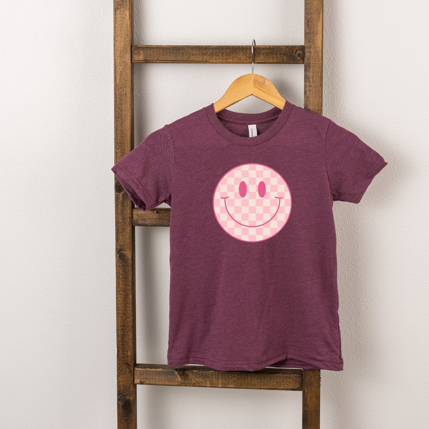 Pink Checker Smiley Face | Toddler Short Sleeve Crew Neck by The Juniper Shop