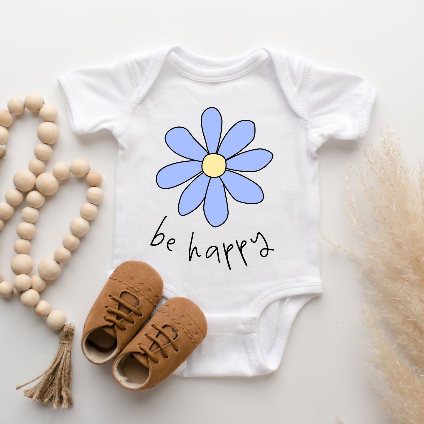 Be Happy Flower | Baby Graphic Short Sleeve Onesie by The Juniper Shop