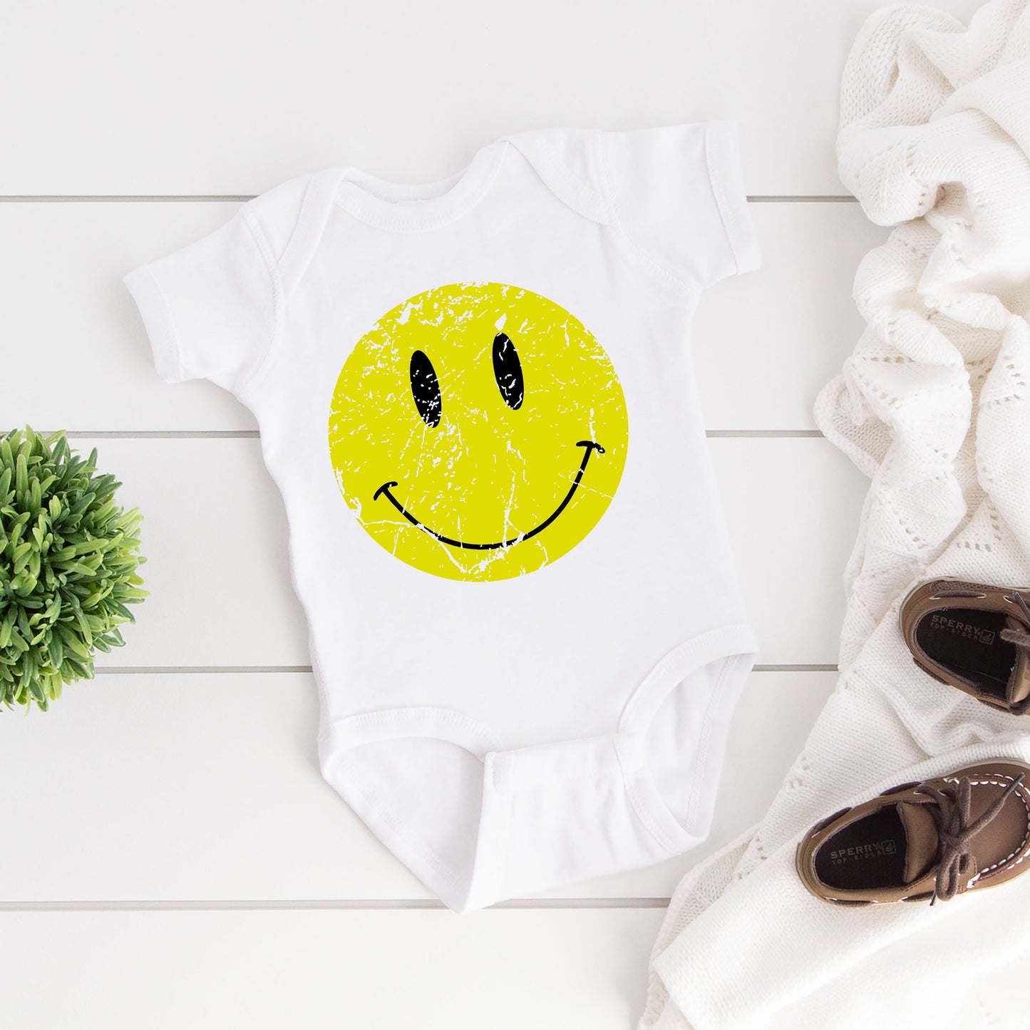 Distressed Smiley Face | Baby Graphic Short Sleeve Onesie by The Juniper Shop